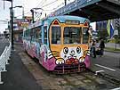 Tramcar with a big cat face painted on the front which somebody referred to as the 
