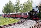 A Cumbria-hauled train returning to Romney station